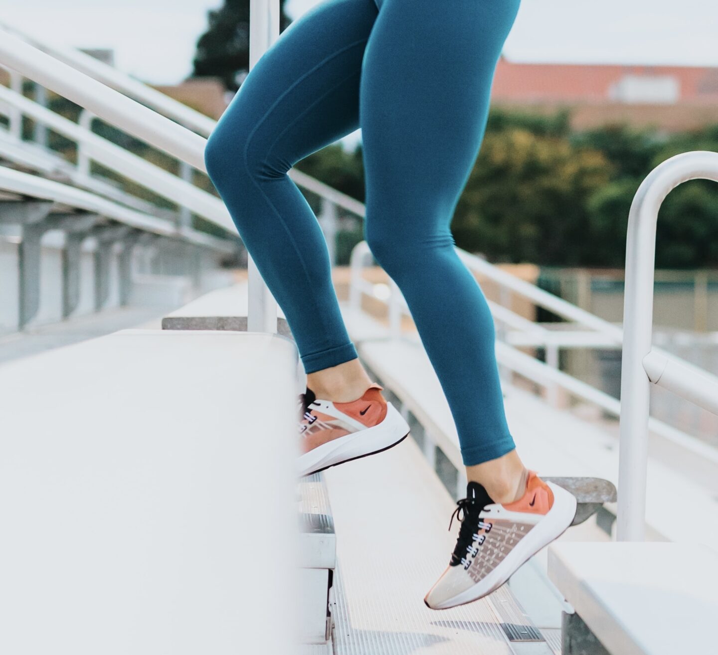 woman walking on stairs for a health and wellness and healthy living tips for a healthier lifestyle