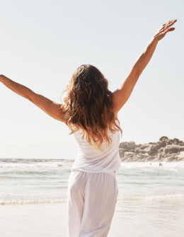 woman happy with arms out on the beach. Important life lessons to learn straight away. best life lessons. good lessons in life. life lessons quotes. life lessons to enrich your life. life lessons to help your personal development and growth