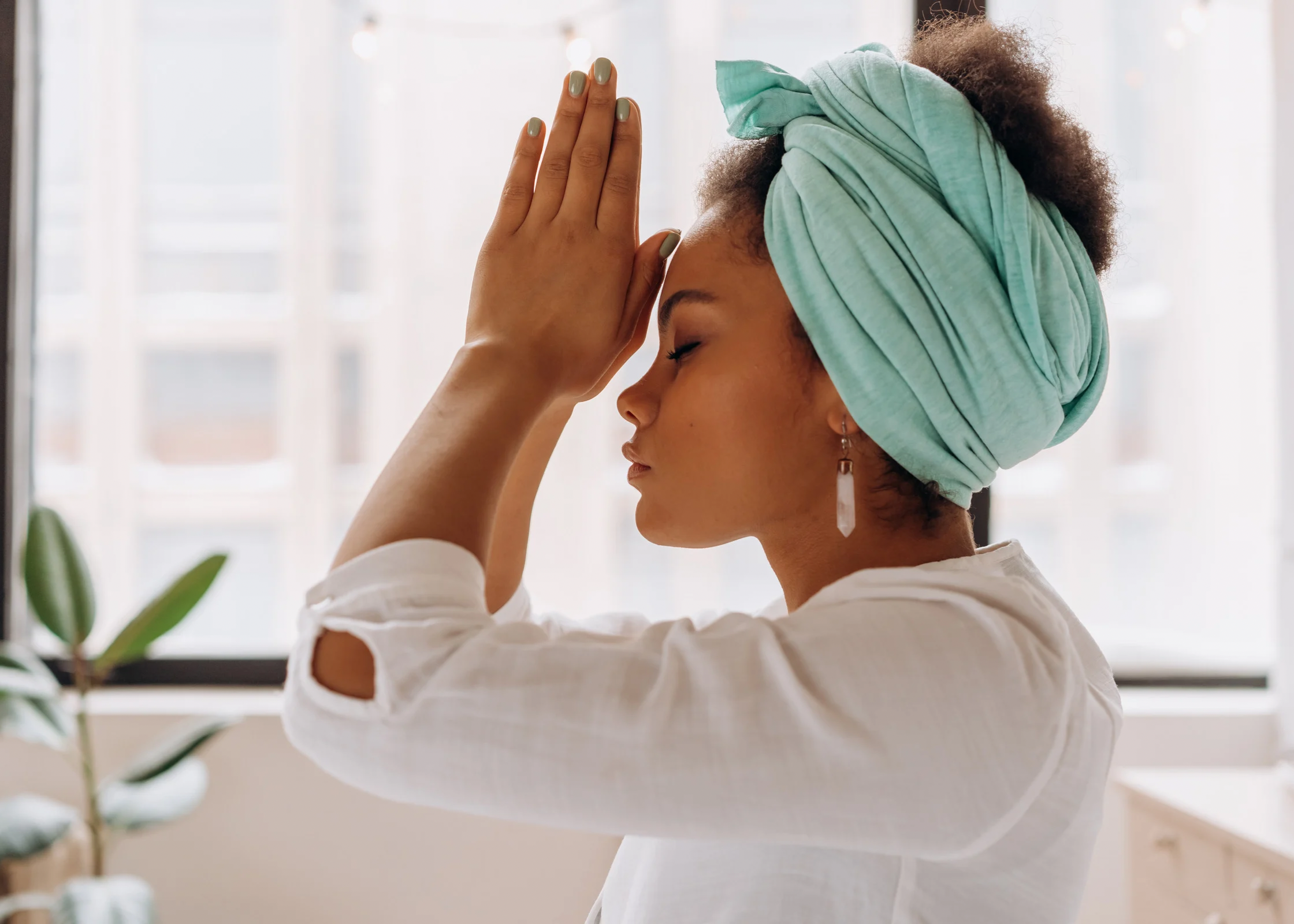 black woman meditating and in a peaceful state. relax after a long, hard, stressful day at work or at home. Ways to unwind and decompress after a busy day and relieve stress.
